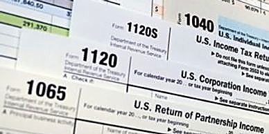 IRS business tax forms 1120-S, 1120, and 1065 fanned out