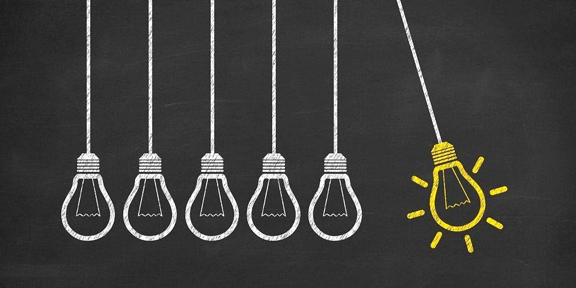 A row of chalk-drawn lightbulbs with one lit in yellow